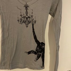 Long sleeve tee with gibbon hanging from a chandelier NWOT